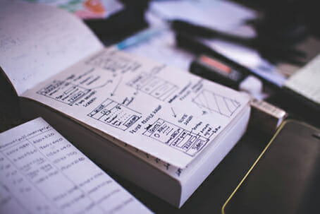 user experience wireframes drawn on a notepad