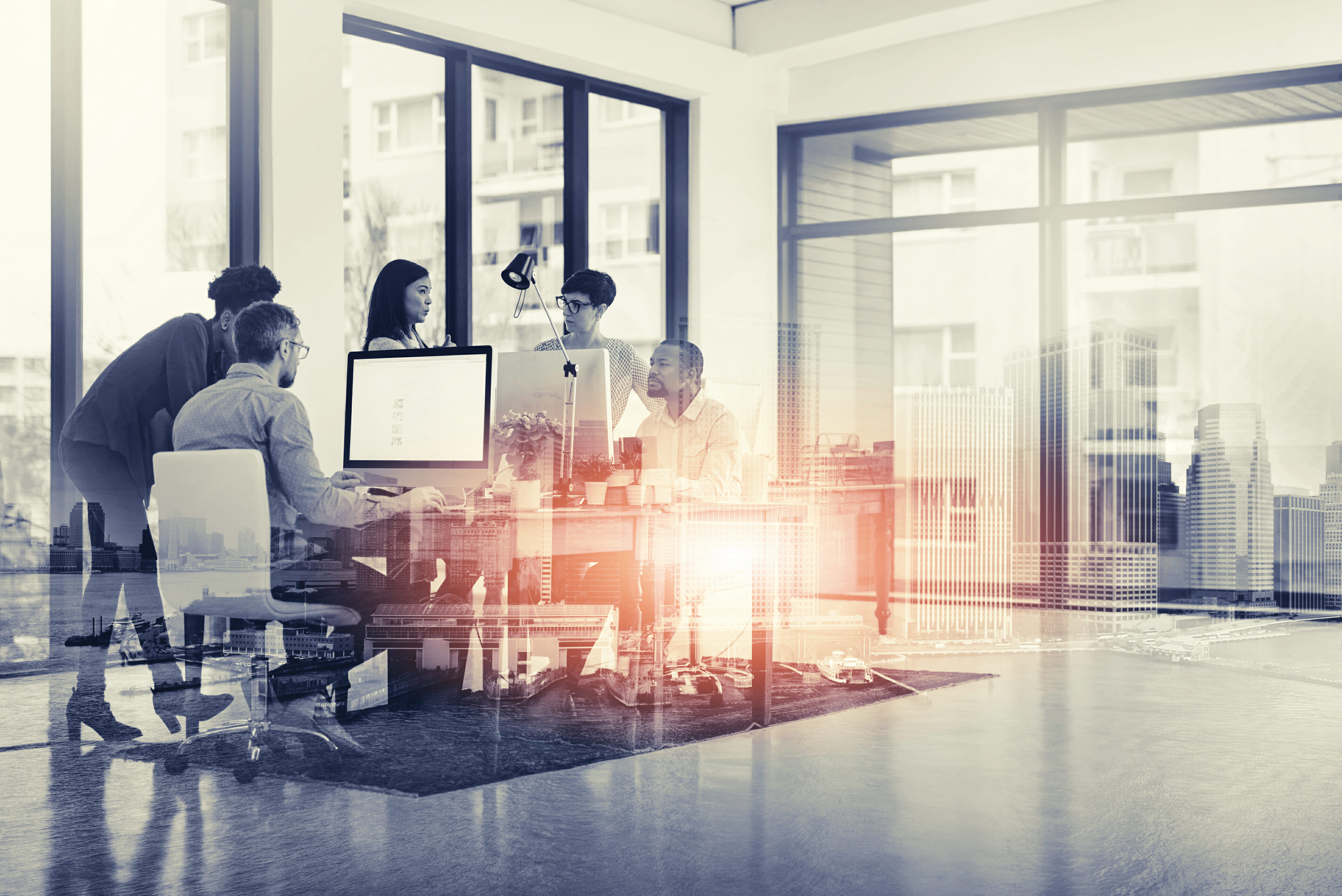Digitally enhanced shot of a group of colleagues working in their office